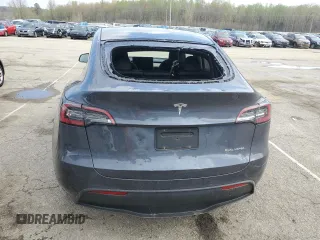 2023 Tesla Model Y Long Range with VIN 7SAYGDEE2PA024693, listed as a Copart auction lot 52595935 with 35,179 mi miles and Salvage Title. Bid and sale history available at DreamBid. Image 6.