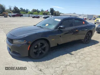 2018 Dodge Charger R/T with VIN 2C3CDXCTXJH238102, listed as a Copart auction lot 56872795 with 60,576 mi miles and Salvage title. Bid and sale history available at DreamBid. Image 1.