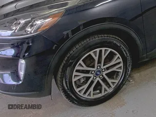 2021 Ford Escape SEL Hybrid with VIN 1FMCU9CZ0MUB25820, listed as a IAAI auction lot 42730204 with 66,443 mi miles and . Bid and sale history available at DreamBid. Image 6.