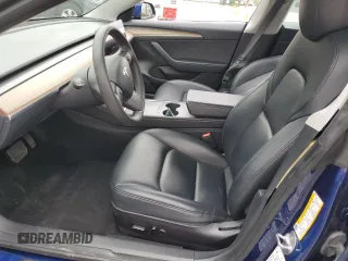 2023 Tesla Model 3 with VIN 5YJ3E1EA7PF450973, listed as a Copart auction lot 61082175 with 47,029 mi miles and Salvage title. Bid and sale history available at DreamBid. Image 7.