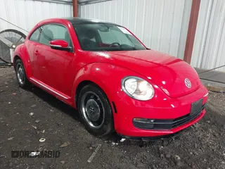 2012 Volkswagen Beetle 2.5L with VIN 3VWJX7AT0CM656148, listed as a IAAI auction lot 41738742 with 53,920 mi miles. Bid and sale history available at carsss.com. Image 1.