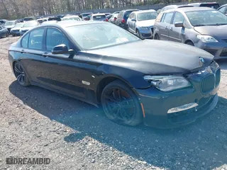 2015 BMW 7 Series 750i xDrive with VIN WBAYB6C57FD965802, listed as a IAAI auction lot 40588698 with 999,999 mi miles. Bid and sale history available at carsss.com. Image 1.