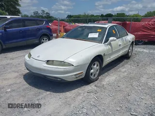 1999 Oldsmobile Aurora z VIN 1G3GR62CXX4100897, wystawiony jako IAAI lot #42277912 z przebiegiem 179 680 mil mil oraz . Historia ofert i sprzedaży dostępna na DreamBid. Obrazek 2.