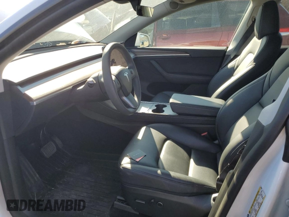 2024 Tesla Model Y with VIN 7SAYGDED9RF094494, listed as a Copart auction lot 50298115 with 7,858 mi miles and Salvage Title. Bid and sale history available at DreamBid. Image 7.