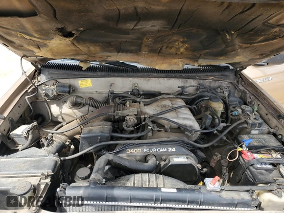 1999 Toyota Tacoma with VIN 4TAWN72NXXZ563507, listed as a Copart auction lot 49888575 with 387,818 mi miles and Salvage title. Bid and sale history available at DreamBid. Image 11.