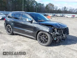 2015 Jeep Grand Cherokee Summit with VIN 1C4RJFJTXFC889977, listed as a IAAI auction lot 41078216 with 71,038 mi miles. Bid and sale history available at carsss.com. Image 1.