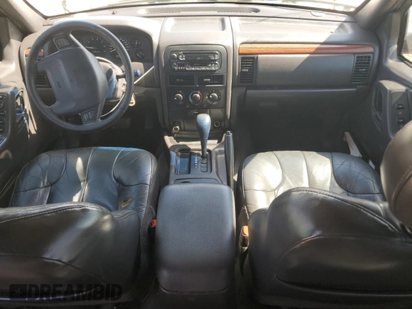 1999 Jeep Grand Cherokee Laredo с VIN 1J4G258S8XC735159, выставлен на аукционе Copart как лот 56247505 с пробегом 241 636 миль миль и Списание • Salvage title. История ставок и продаж доступна на DreamBid. Изображение 8.