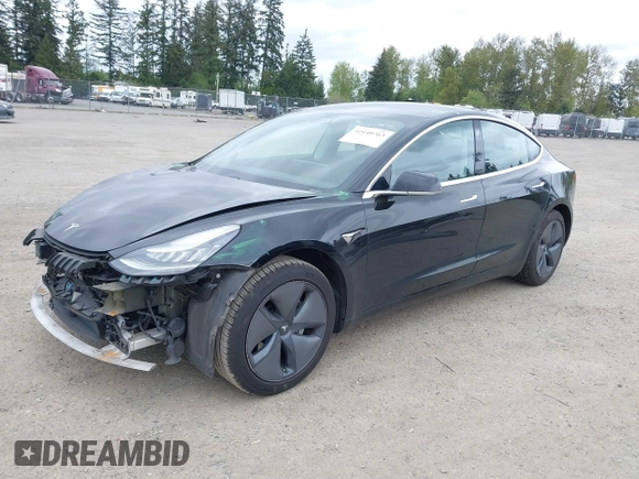 2019 Tesla Model 3 Mid Range with VIN 5YJ3E1EA6KF415656, listed as a IAAI auction lot 42140763 with 71,408 mi miles and . Bid and sale history available at carsss.com. Image 2.