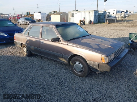 1985 Toyota Camry z VIN JT2SV12EXF0291360, wystawiony jako IAAI lot #42094530 z przebiegiem 426 444 mil mil oraz . Historia ofert i sprzedaży dostępna na DreamBid. Obrazek 1.