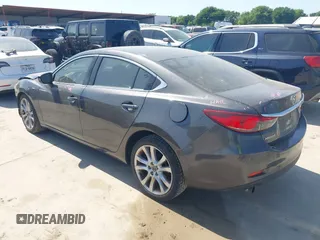 2014 Mazda 6 i Touring with VIN JM1GJ1V55E1105379, listed as a IAAI auction lot 42010585 with 153,870 mi miles and . Bid and sale history available at DreamBid. Image 3.