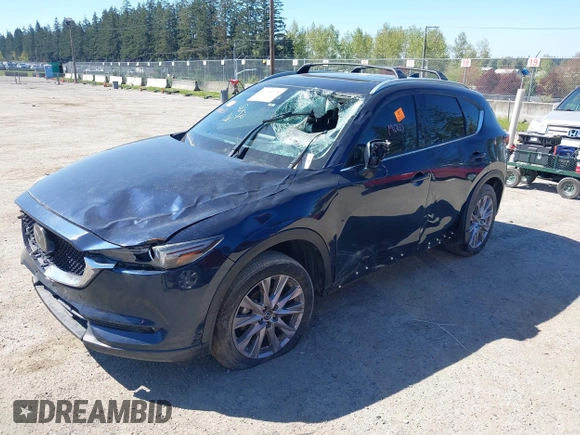 2020 Mazda CX-5 Grand Touring with VIN JM3KFBDM7L0724005, listed as a IAAI auction lot 42034658 with 90,631 mi miles. Bid and sale history available at carsss.com. Image 2.