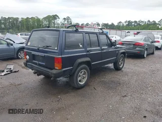1996 Jeep Cherokee SE z VIN 1J4FJ28S5TL129065, wystawiony jako IAAI lot #42231133 z przebiegiem 225 320 mil mil oraz . Historia ofert i sprzedaży dostępna na DreamBid. Obrazek 4.