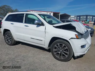 2017 Jeep Grand Cherokee Overland with VIN 1C4RJECG5HC959981, listed as a IAAI auction lot 41638958 with 102,122 mi miles. Bid and sale history available at carsss.com. Image 1.