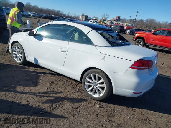 2015 Volkswagen Eos Komfort with VIN WVWBW8AH0FV001011, listed as a IAAI auction lot 41297299 with 81,444 mi miles and . Bid and sale history available at DreamBid. Image 3.