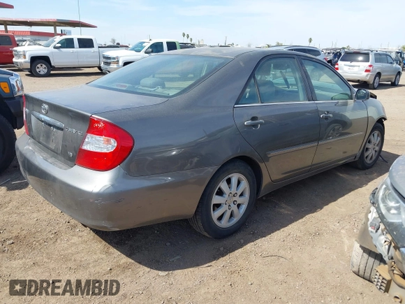 2004 Toyota Camry LE with VIN 4T1BF30K24U569209, listed as a IAAI auction lot 41988665 with 191,017 mi miles. Bid and sale history available at carsss.com. Image 4.