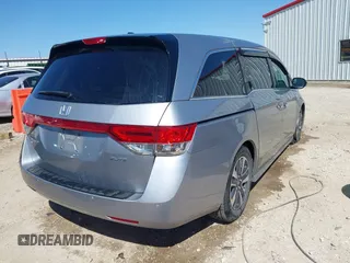 2016 Honda Odyssey Touring Elite with VIN 5FNRL5H96GB090653, listed as a IAAI auction lot 41720195 with 68,969 mi miles. Bid and sale history available at carsss.com. Image 4.