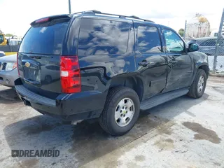 2013 Chevrolet Tahoe LS with VIN 1GNSCAE04DR104790, listed as a IAAI auction lot 42225652 with 119,948 mi miles and . Bid and sale history available at DreamBid. Image 4.