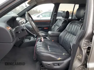 1999 Jeep Grand Cherokee Limited with VIN 1J4GW68SXXC582343, listed as a Copart auction lot 51067695 with 157,456 mi miles and Clean Title. Bid and sale history available at carsss.com. Image 7.