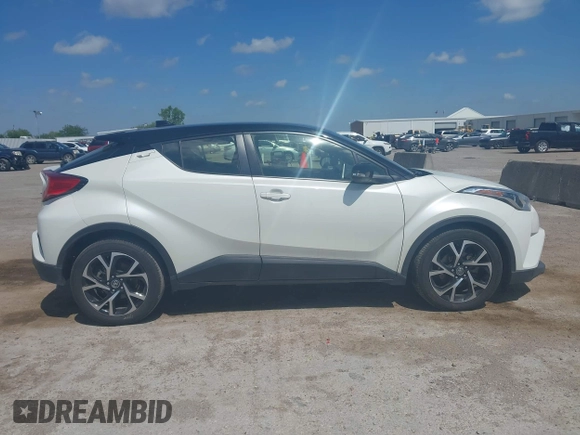 2019 Toyota C-HR XLE z VIN JTNKHMBX8K1061351, wystawiony jako IAAI lot #42053354 z przebiegiem 76 000 mil mil oraz . Historia ofert i sprzedaży dostępna na DreamBid. Obrazek 13.