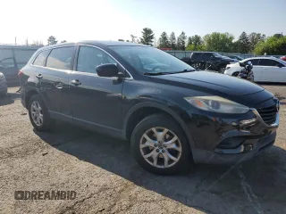 2014 Mazda CX-9 Sport with VIN JM3TB2BV6E0431971, listed as a Copart auction lot 63778635 with 136,287 mi miles and Salvage title. Bid and sale history available at DreamBid. Image 4.