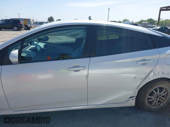 2021 Toyota Prius LE with VIN JTDKAMFP2M3177459, listed as a IAAI auction lot 42093828 with 65,501 mi miles and . Bid and sale history available at DreamBid. Image 14.