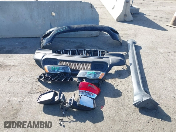 2019 Jeep Grand Cherokee Altitude with VIN 1C4RJEAG7KC852263, listed as a IAAI auction lot 41590946 with 83,356 mi miles and . Bid and sale history available at DreamBid. Image 12.