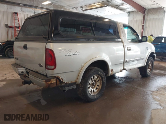 2001 Ford F-150 XL with VIN 2FTRF18W31CB06246, listed as a IAAI auction lot 42307983 with 148,440 mi miles and . Bid and sale history available at DreamBid. Image 4.