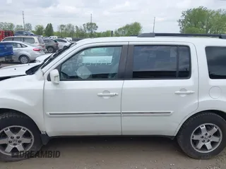 2011 Honda Pilot Touring z VIN 5FNYF4H96BB106873, wystawiony jako IAAI lot #42154795 z przebiegiem 162 282 mil mil oraz . Historia ofert i sprzedaży dostępna na DreamBid. Obrazek 14.