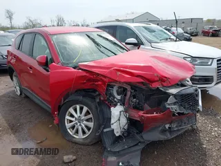2014 Mazda CX-5 Touring with VIN JM3KE2CY4E0411780, listed as a IAAI auction lot 41903570 with 103,658 mi miles and . Bid and sale history available at carsss.com. Image 1.