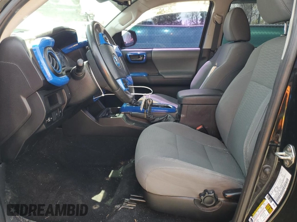 2019 Toyota Tacoma SR z VIN 3TMCZ5AN1KM253032, wystawiony jako Copart lot #52598445 z przebiegiem 69 489 mil mil oraz Szkoda całkowita • Salvage title. Historia ofert i sprzedaży dostępna na DreamBid. Obrazek 7.