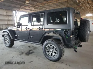2015 Jeep Wrangler Unlimited Rubicon Hard Rock with VIN 1C4HJWFG1FL532288, listed as a Copart auction lot 62262545 with 91,807 mi miles and Salvage title. Bid and sale history available at DreamBid. Image 2.