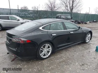 2013 Tesla Model S with VIN 5YJSA1DN9DFP03380, listed as a IAAI auction lot 41865213 with 184,831 mi miles. Bid and sale history available at carsss.com. Image 2.