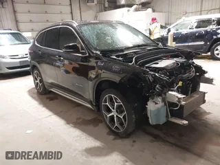 2016 BMW X1 xDrive28i with VIN WBXHT3C33GP886935, listed as a IAAI auction lot 41707367 with 73,201 mi miles. Bid and sale history available at carsss.com. Image 1.