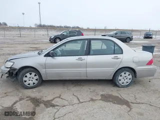 2002 Mitsubishi Lancer ES with VIN JA3AJ26E62U043039, listed as a IAAI auction lot 41600217 with 141,217 mi miles. Bid and sale history available at carsss.com. Image 14.