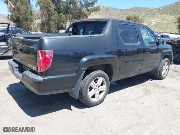 2011 Honda Ridgeline RTL with VIN 5FPYK1F50BB001442, listed as a IAAI auction lot 42023615 with 189,170 mi miles. Bid and sale history available at carsss.com. Image 4.