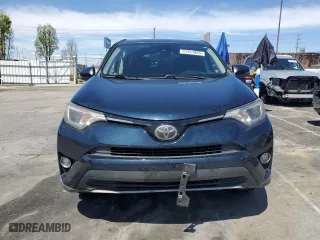 2018 Toyota RAV4 XLE with VIN JTMWFREV9JJ745584, listed as a Copart auction lot 51451885 with 114,985 mi miles and Salvage Title. Bid and sale history available at carsss.com. Image 5.