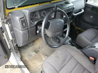 2002 Jeep Wrangler Sport z VIN 1J4FA49S22P763189, wystawiony jako Copart lot #57650295 z przebiegiem 197 383 mil mil oraz Czysty tytuł • Clean title. Historia ofert i sprzedaży dostępna na DreamBid. Obrazek 8.