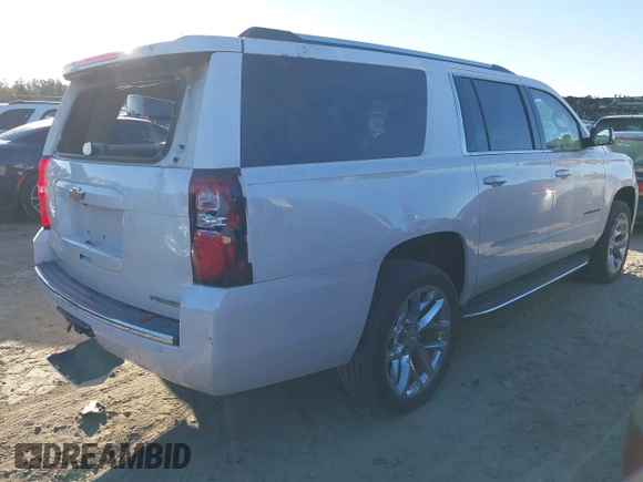 2019 Chevrolet Suburban Premier with VIN 1GNSCJKC0KR293658, listed as a IAAI auction lot 40563834 with 153,619 mi miles and . Bid and sale history available at DreamBid. Image 4.