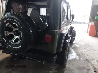 1998 Jeep Wrangler SE with VIN 1J4FY29P2WP733255, listed as a IAAI auction lot 41554602 with 157,316 mi miles. Bid and sale history available at carsss.com. Image 4.