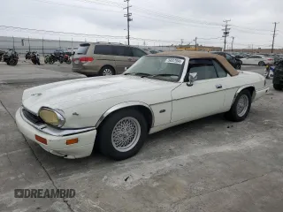 1994 Jaguar XJS with VIN SAJNX2749RC191243, listed as a Copart auction lot 76037994 with 74,842 mi miles and Salvage Title. Bid and sale history available at carsss.com. Image 1.