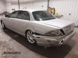 2004 Jaguar XJ with VIN SAJWA71C04SG33993, listed as a IAAI auction lot 41193040 with 79,944 mi miles. Bid and sale history available at carsss.com. Image 3.