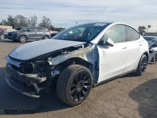 2023 Tesla Model Y Long Range with VIN 7SAYGDEE0PF631811, listed as a IAAI auction lot 41400620 with 81,358 mi miles. Bid and sale history available at carsss.com. Image 20.