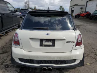 2009 MINI Hardtop S with VIN WMWMF73569TW84934, listed as a Copart auction lot 51344975 with 123,929 mi miles and Salvage title. Bid and sale history available at DreamBid. Image 6.
