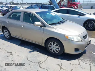 2009 Toyota Corolla with VIN 1NXBU40E69Z047356, listed as a IAAI auction lot 42640370 with 184,749 mi miles and . Bid and sale history available at DreamBid. Image 1.