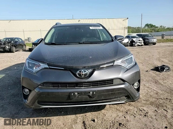 2018 Toyota RAV4 XLE with VIN 2T3WFREV0JW517488, listed as a Copart auction lot 51000975 with 68,105 mi miles and Salvage title. Bid and sale history available at DreamBid. Image 11.
