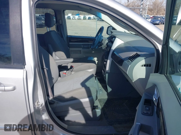 2010 Dodge Grand Caravan SXT with VIN 2D4RN5D19AR406197, listed as a IAAI auction lot 41854505 with 140,760 mi miles and . Bid and sale history available at DreamBid. Image 5.