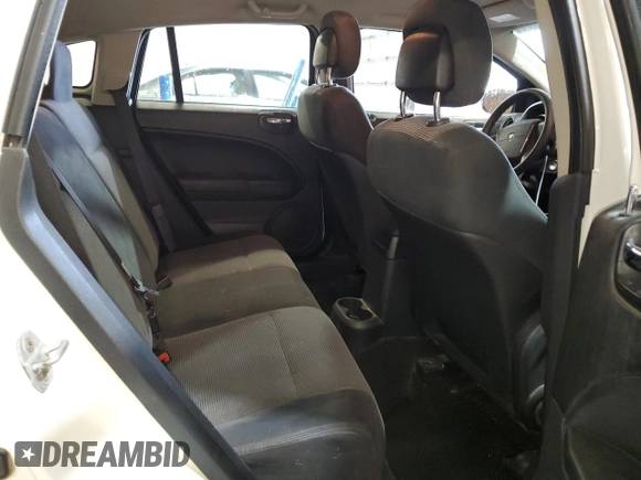 2011 Dodge Caliber Heat z VIN 1B3CB5HA6BD222153, wystawiony jako Copart lot #56881205 z przebiegiem 153 950 mil mil oraz Szkody całkowita. Historia ofert i sprzedaży dostępna na DreamBid. Obrazek 11.