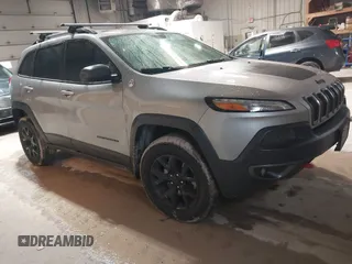 2014 Jeep Cherokee Trailhawk z VIN 1C4PJMBS4EW254963, wystawiony jako IAAI lot #42065845 z przebiegiem 187 356 mil mil oraz . Historia ofert i sprzedaży dostępna na DreamBid. Obrazek 1.