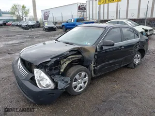 2007 Kia Optima LX with VIN KNAGE123175133499, listed as a IAAI auction lot 41958955 with 132,480 mi miles. Bid and sale history available at carsss.com. Image 2.
