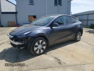 2023 Tesla Model Y Long Range z VIN 7SAYGDEE7PF875147, wystawiony jako Copart lot #55075255 z przebiegiem 56 657 mil mil oraz Szkoda całkowita • Salvage title. Historia ofert i sprzedaży dostępna na DreamBid. Obrazek 1.